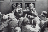 BEF troops are given gifts of cigarettes and sweets at Wandsworth Road station, London.